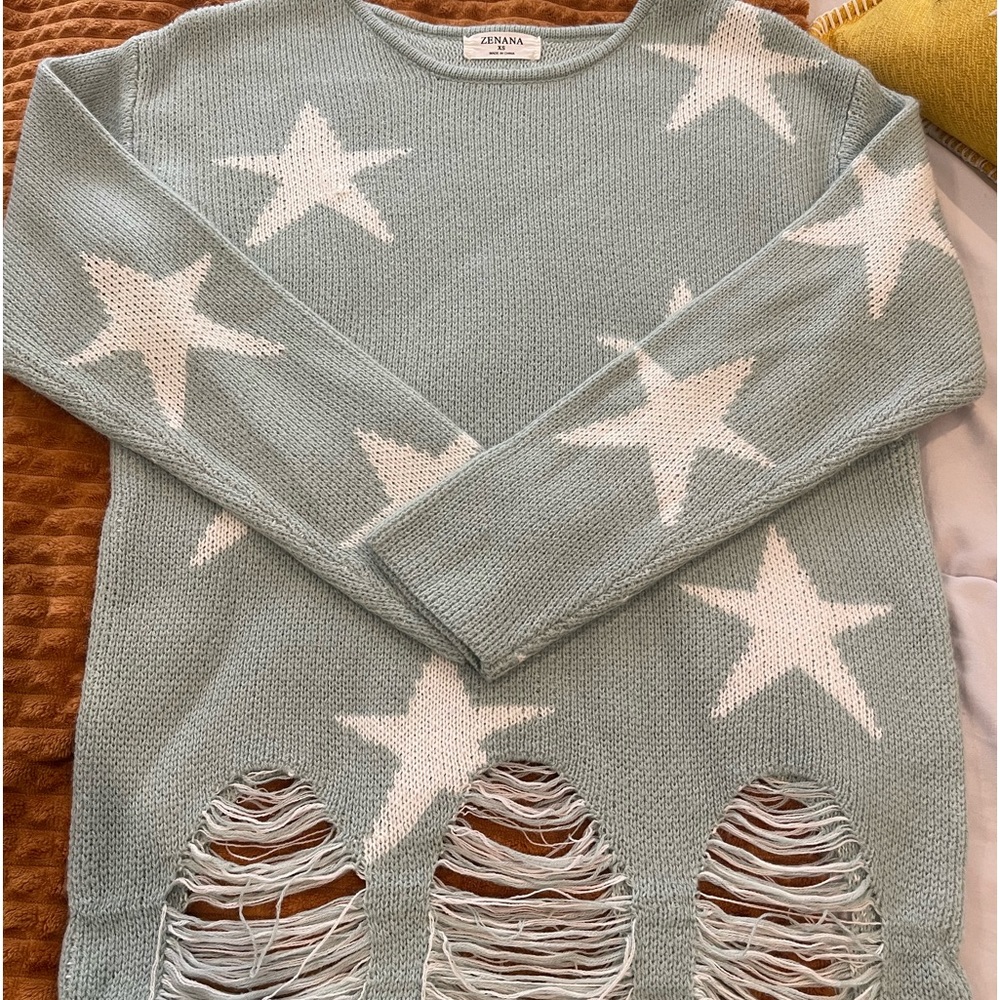 Boutique sweater.. never worn. Size xtra small but fits more like a medium.